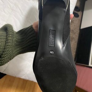 Unworn high leather boots in black